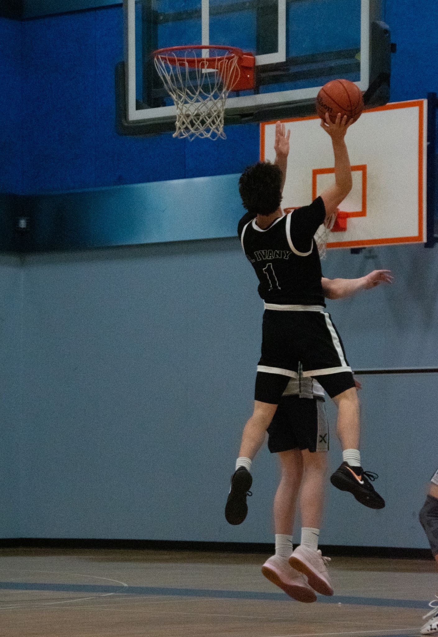 An Eagles player driving to the basket during a game